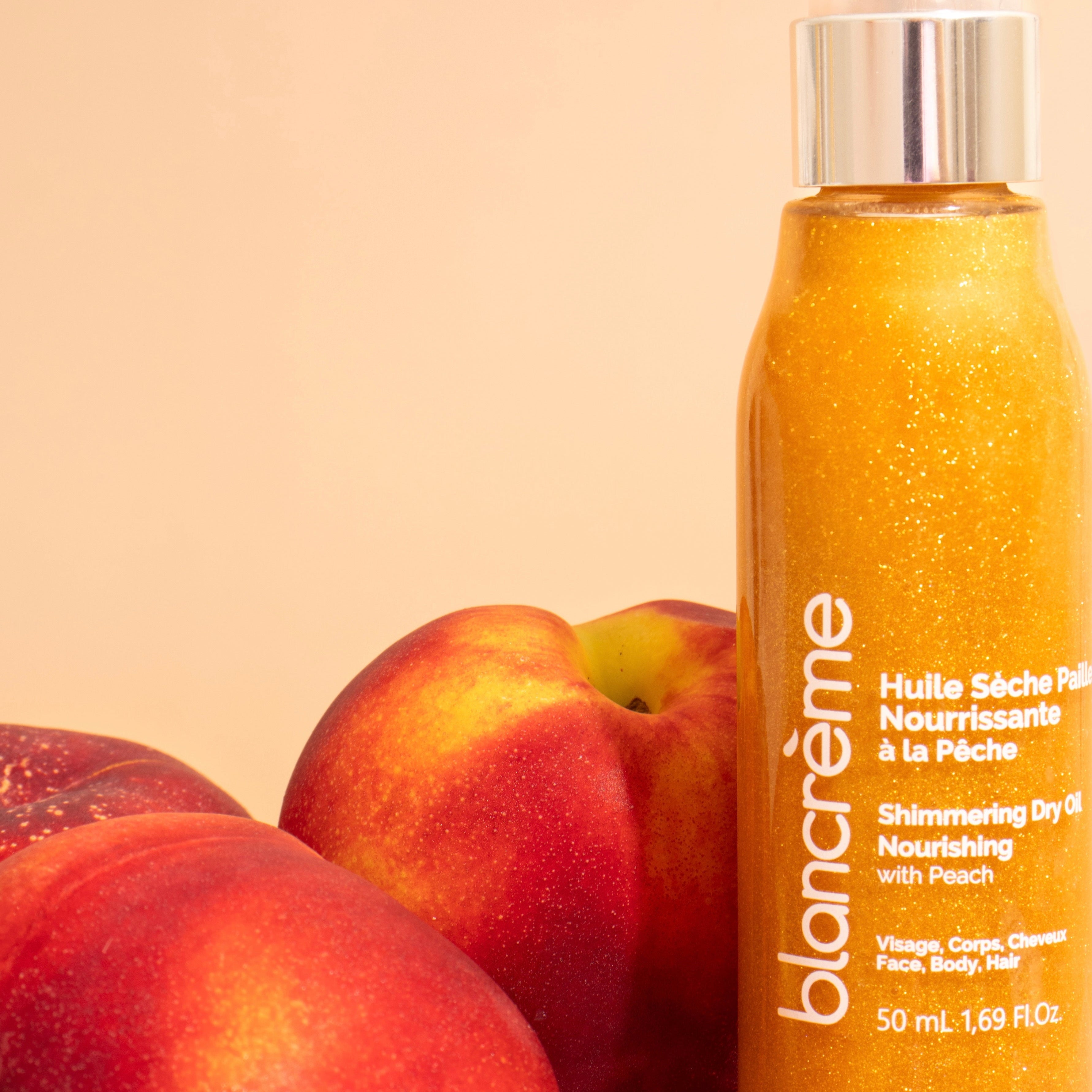 Huile sèche pailletée nourrissante - Pêche